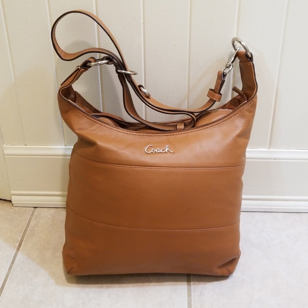 Brown leather coach bag.